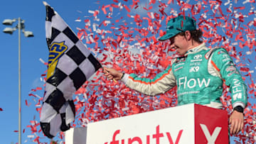 KANSAS CITY, KANSAS - OCTOBER 19: Brandon Jones, driver of the #19 Flow Toyota, celebrates in Victory Lane after winning the NASCAR Xfinity Series Kansas Lottery 300 at Kansas Speedway on October 19, 2019 in Kansas City, Kansas. (Photo by Jared C. Tilton/Getty Images)