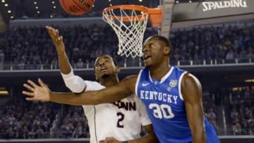 Apr 7, 2014; Arlington, TX, USA; Kentucky Wildcats forward Julius Randle (30) battles for a loose ball with Connecticut Huskies forward DeAndre Daniels (2) in the second half during the championship game of the Final Four in the 2014 NCAA Mens Division I Championship tournament at AT&T Stadium. Mandatory Credit: Robert Deutsch-USA TODAY Sports