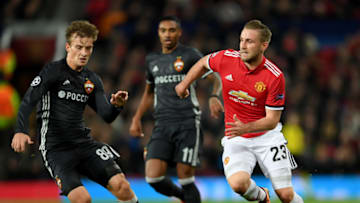 MANCHESTER, ENGLAND - DECEMBER 05: Luke Shaw of Manchester United is challenged by Konstantin Kuchaev of CSKA Moscow during the UEFA Champions League group A match between Manchester United and CSKA Moskva at Old Trafford on December 5, 2017 in Manchester, United Kingdom. (Photo by Laurence Griffiths/Getty Images)