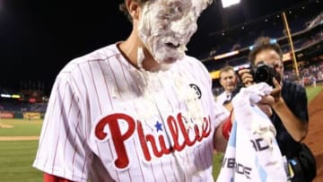 Jun 26, 2014; Philadelphia, PA, USA; Philadelphia Phillies second baseman Chase Utley (26) is pied in the face after hitting a two RBI walk off home run in the bottom of the fourteenth inning in a game against the Miami Marlins at Citizens Bank Park. The Phillies won 5-3 in the bottom of the fourteenth inning. Mandatory Credit: Bill Streicher-USA TODAY Sports