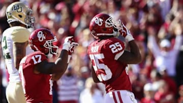 Nov 12, 2016; Norman, OK, USA; Oklahoma Sooners running back Joe Mixon (25) celebrates with wide receiver Jordan Smallwood (17) after scoring a touchdown during the second half against the Baylor Bears at Gaylord Family - Oklahoma Memorial Stadium. Mandatory Credit: Kevin Jairaj-USA TODAY Sports