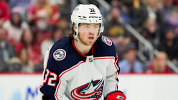 Apr 9, 2022; Detroit, Michigan, USA; Columbus Blue Jackets defenseman Jake Christiansen (32) keeps his eyes on the puck during the second period against the Detroit Red Wings at Little Caesars Arena. Mandatory Credit: Raj Mehta-USA TODAY Sports