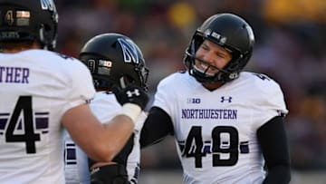 MINNEAPOLIS, MINNESOTA - NOVEMBER 17: The Northwestern Wildcats congratulate teammate Jake Collins #49 on a field goal against the Minnesota Golden Gophers during the fourth quarter of the game at TCFBank Stadium on November 17, 2018 in Minneapolis, Minnesota. Northwestern defeated Minnesota 24-14. (Photo by Hannah Foslien/Getty Images)