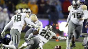Nov 27, 2015; Fort Worth, TX, USA; Baylor Bears safety Taion Sells (26) attempts to recover a fumble in the second quarter against the TCU Horned Frogs at Amon G. Carter Stadium. Mandatory Credit: Tim Heitman-USA TODAY Sports