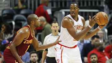 Oct 10, 2016; Atlanta, GA, USA; Atlanta Hawks center Dwight Howard (8) looks to pass the ball as Cleveland Cavaliers guard James Jones (1) defends in the second quarter at Philips Arena. Mandatory Credit: Brett Davis-USA TODAY Sports