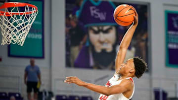 Lake Highlands Wildcats guard Tre Johnson (20) dunks on a fast break during the first quarter of a game against the Newton Rams during the 49th annual City of Palms Classic at Suncoast Arena in Ft. Myers on Friday, Dec. 16, 2022.CENTERPIECE Lakehighland V Newton Cop 0003