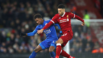 LIVERPOOL, ENGLAND - DECEMBER 30: Demarai Gray of Leicester City is challenged by Alex Oxlade-Chamberlain of Liverpool during the Premier League match between Liverpool and Leicester City at Anfield on December 30, 2017 in Liverpool, England. (Photo by Clive Brunskill/Getty Images)