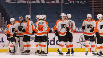 Feb 7, 2021; Washington, District of Columbia, USA; Philadelphia Flyers goaltender Carter Hart (79) celebrates with teammates after their game against the Washington Capitals at Capital One Arena. Mandatory Credit: Geoff Burke-USA TODAY Sports