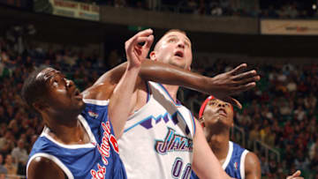 SALT LAKE CITY - DECEMBER 5: Elton Brand #42 and Quentin Richardson #3 of the Los Angeles Clippers battles for a rebound against Greg Ostertag #00 of the Utah Jazz on Decenber 5, 2003 at the Delta Center in Salt Lake City, Utah. (Photo By Kent Horner/NBAE via Getty Images)