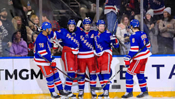 Mar 4, 2022; New York, New York, USA; New York Rangers left wing Chris Kreider (20) celebrates a goal with center Mika Zibanejad (93) and left wing Alexis Lafrenire (13) against the New Jersey Devils during the third period at Madison Square Garden. Mandatory Credit: Danny Wild-USA TODAY Sports