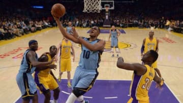 Mar 22, 2016; Los Angeles, CA, USA; Memphis Grizzlies forward Jarell Martin (10) is defended by Los Angeles Lakers forward Julius Randle (30) during an NBA game at Staples Center. The Lakers defeated the Grizzlies 107-100. Mandatory Credit: Kirby Lee-USA TODAY Sports