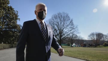 WASHINGTON, DC - JANUARY 11: U.S. President Joe Biden walks to speak to reporters before boarding Marine One on the South Lawn of the White House on January 11, 2022 in Washington, DC. President Biden is visiting Atlanta, Georgia, along with U.S. Vice President Kamala Harris and several lawmakers to deliver remarks on passing further voting rights legislation. Biden will also make stops at the King Center and Ebenezer Baptist Church. (Photo by Anna Moneymaker/Getty Images)
