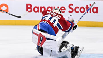 MONTREAL, CANADA - OCTOBER 24: Cayden Primeau #30 of the Montreal Canadiens dives to make a save during the first period against the New Jersey Devils at the Bell Centre on October 24, 2023 in Montreal, Quebec, Canada. The New Jersey Devils defeated the Montreal Canadiens 5-2. (Photo by Minas Panagiotakis/Getty Images)