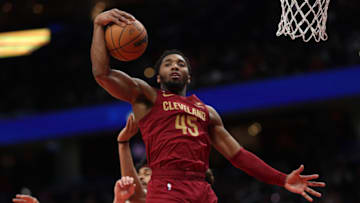 WASHINGTON, DC - FEBRUARY 06: Donovan Mitchell #45 of the Cleveland Cavaliers grabs a rebound against the Washington Wizards during the second half at Capital One Arena on February 06, 2023 in Washington, DC. NOTE TO USER: User expressly acknowledges and agrees that, by downloading and or using this photograph, User is consenting to the terms and conditions of the Getty Images License Agreement. (Photo by Patrick Smith/Getty Images)