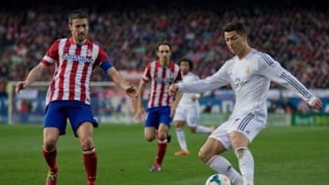 MADRID, SPAIN - MARCH 02: Cristiano Ronaldo (R) of Real Madrid CF competes for the ball with Gabi Fernandez (L) of Atletico de Madrid during the La Liga match between Club Atletico de Madrid and Real Madrid CF at Vicente Calderon Stadium on March 2, 2014 in Madrid, Spain. (Photo by Gonzalo Arroyo Moreno/Getty Images)