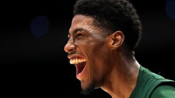 STVM guard Sencire Harris is all smiles as the Irish increase their lead over Archbishop Alter during the second half of the Division II state semifinal at UD Arena on Friday.Stvmsemis 12