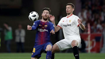 MADRID, SPAIN - APRIL 21: Lionel Messi (L) of Barcelona in action against Clement Lenglet (R) of Sevilla during Copa del Rey Final soccer match between Sevilla and Barcelona at Wanda Metropolitano Stadium in Madrid, Spain on April 21, 2018. (Photo by Burak Akbulut/Anadolu Agency/Getty Images)