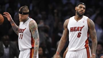 Jan 10, 2014; Brooklyn, NY, USA; Miami Heat small forward LeBron James (6) reacts after fouling out against the Brooklyn Nets during the first overtime at Barclays Center. The Brooklyn Nets won the game 104-95 in double overtime. Mandatory Credit: Joe Camporeale-USA TODAY Sports