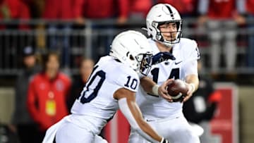 COLUMBUS, OHIO - OCTOBER 30: Sean Clifford #14 of the Penn State Nittany Lions hands the ball off to John Lovett #10 during the first half of their game against the Ohio State Buckeyes at Ohio Stadium on October 30, 2021 in Columbus, Ohio. (Photo by Emilee Chinn/Getty Images)