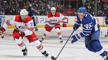 TORONTO,ON - DECEMBER 19: Leo Komarov #47 of the Toronto Maple Leafs breaks in against Justin Faulk #27 of the Carolina Hurricanes during an NHL game at the Air Canada Centre on December 19, 2017 in Toronto, Ontario, Canada. The Maple Leafs defeated the Hurricanes 8-1. (Photo by Claus Andersen/Getty Images)