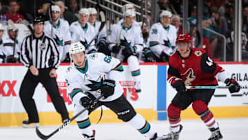 GLENDALE, ARIZONA - JANUARY 14: Kevin Labanc #62 of the San Jose Sharks skates with the puck ahead of Michael Grabner #40 of the Arizona Coyotes during the third period of the NHL game at Gila River Arena on January 14, 2020 in Glendale, Arizona. The Coyotes defeated the Sharks 6-3. (Photo by Christian Petersen/Getty Images)