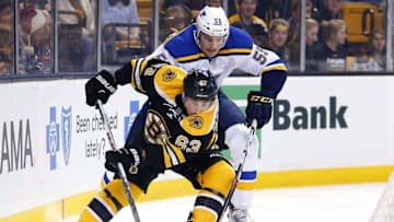 Dec 22, 2015; Boston, MA, USA; St. Louis Blues defenseman Colton Parayko (55) tries to stop Boston Bruins left wing Brad Marchand (63) during the first period at TD Garden. Mandatory Credit: Winslow Townson-USA TODAY Sports