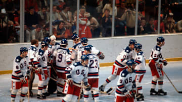 LAKE PLACID, NY - FEBRUARY 22: The United States Hockey team celebrates after they defeated the Soviet Union during a metal round game of the Winter Olympics February 22, 1980 at the Olympic Center in Lake Placid, New York. The game was named "The Miracle On Ice" as the United States defeated the Soviet Union 4-3. . (Photo by Focus on Sport/Getty Images) *** Local Caption ***