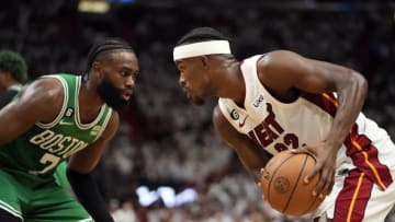 May 27, 2023; Miami, Florida, USA; Miami Heat forward Jimmy Butler (22) controls the ball against Boston Celtics guard Jaylen Brown (7) in the second quarter during game six of the Eastern Conference Finals for the 2023 NBA playoffs at Kaseya Center. Mandatory Credit: Rich Storry-USA TODAY Sports