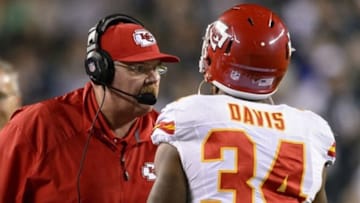 Sep 19, 2013; Philadelphia, PA, USA; Kansas City Chiefs head coach Andy Reid talks with running back Knile Davis (34) during the fourth quarter against the Philadelphia Eagles at Lincoln Financial Field. The Chiefs defeated the Eagles 26-16. Mandatory Credit: Howard Smith-USA TODAY Sports