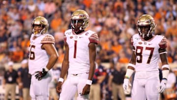 CHARLOTTESVILLE, VA - SEPTEMBER 14: Ryan Roberts #56, James Blackman #1 and Camren McDonald #87 of the Florida State Seminoles in the first half during a game against the Virginia Cavaliers at Scott Stadium on September 14, 2019 in Charlottesville, Virginia. (Photo by Ryan M. Kelly/Getty Images)