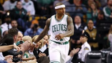 Apr 6, 2016; Boston, MA, USA; Boston Celtics guard Isaiah Thomas (4) high fives a fan after making a basket against the New Orleans Pelicans during the first half at TD Garden. Mandatory Credit: Winslow Townson-USA TODAY Sports