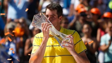 KEY BISCAYNE, FL - APRIL 01: John Isner of the United States poses with the Butch Buchholz Trophy after defeating Alexander Zverev of Germany in the men's final on Day 14 of the Miami Open Presented by Itau at Crandon Park Tennis Center on April 1, 2018 in Key Biscayne, Florida. (Photo by Michael Reaves/Getty Images)
