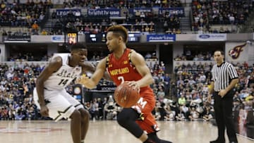 Mar 12, 2016; Indianapolis, IN, USA; Maryland Terrapins guard Melo Trimble (0) drives to the basket against Michigan State Spartans guard Eron Harris (14) during the Big Ten Conference tournament at Bankers Life Fieldhouse. Michigan State defeats Maryland 64-61. Mandatory Credit: Brian Spurlock-USA TODAY Sports