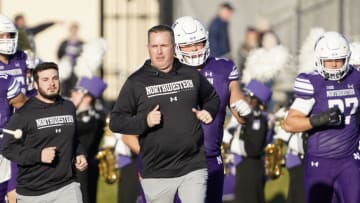 Nov 26, 2022; Evanston, Illinois, USA; Northwestern Wildcats head coach Pat Fitzgerald leads his team on the field against the Illinois Fighting Illini at Ryan Field. Mandatory Credit: David Banks-USA TODAY Sports