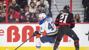 Feb 19, 2023; Ottawa, Ontario, CAN; St. Louis Blues defenseman Calle Rosen (43) steals with the puck against Ottawa Senators right wing Matthieu Joseph (21) in the first period at the Canadian Tire Centre. Mandatory Credit: Marc DesRosiers-USA TODAY Sports