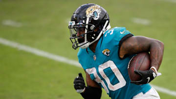 Oct 18, 2020; Jacksonville, Florida, USA; Jacksonville Jaguars running back James Robinson (30) runs for a touchdown against the Detroit Lions during the second half at TIAA Bank Field. Mandatory Credit: Reinhold Matay-USA TODAY Sports