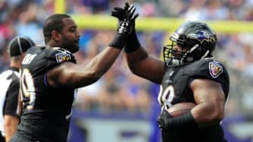 Sep 28, 2014; Baltimore, MD, USA; Baltimore Ravens defensive tackle Brandon Williams (98) high fives defensive end Chris Canty (99) after recovering a fumble in the fourth quarter against the Carolina Panthers at M&T Bank Stadium. Mandatory Credit: Evan Habeeb-USA TODAY Sports