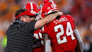 ATHENS, GEORGIA - NOVEMBER 05: Head coach Kirby Smart of the Georgia Bulldogs talks with Malaki Starks #24 of the Georgia Bulldogs during the fourth quarter against the Tennessee Volunteers at Sanford Stadium on November 05, 2022 in Athens, Georgia. (Photo by Todd Kirkland/Getty Images)