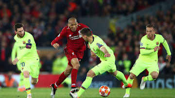 LIVERPOOL, ENGLAND - MAY 07: Fabinho of Liverpool is stopped Lionel Messi and Clement Lenglet of Barcelona during the UEFA Champions League Semi Final second leg match between Liverpool and Barcelona at Anfield on May 07, 2019 in Liverpool, England. (Photo by Clive Brunskill/Getty Images)