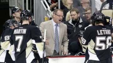 May 4, 2014; Pittsburgh, PA, USA; Pittsburgh Penguins head coach Dan Bylsma (middle) talks to the team during a time-out against the New York Rangers in the third period in game two of the second round of the 2014 Stanley Cup Playoffs at the CONSOL Energy Center. The Pens won 3-0. Mandatory Credit: Charles LeClaire-USA TODAY Sports