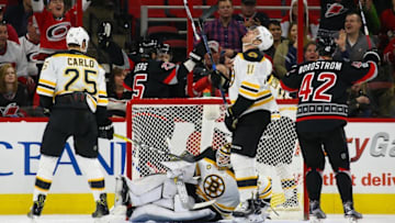 Jan 8, 2017; Raleigh, NC, USA; Carolina Hurricanes forward Jay McClement (18) is congratulated by his teammate forward Viktor Stalberg (25) after his third period goal against Boston Bruins at PNC Arena. The Carolina Hurricanes defeated the Boston Bruins 4-3. Mandatory Credit: James Guillory-USA TODAY Sports