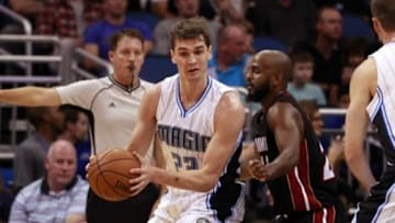 Oct 13, 2015; Orlando, FL, USA; Orlando Magic forward Mario Hezonja (23) drives to the basket as Miami Heat guard John Lucas III (24) defends during the second quarter at Amway Center. Mandatory Credit: Kim Klement-USA TODAY Sports