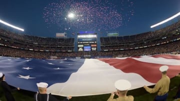 Dec 27, 2014; San Diego, CA, USA; Marines hold the United States flag as fireworks explodes during the playing of the national anthem before the 2014 Holiday Bowl between the Nebraska Cornhuskers and the Southern California Trojans at Qualcomm Stadium. Mandatory Credit: Kirby Lee-USA TODAY Sports