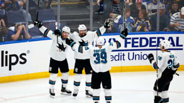 ST LOUIS, MISSOURI - MAY 15: Erik Karlsson #65 of the San Jose Sharks celebrates with his teammates after scoring the game winning goal in overtime to defeat the St. Louis Blues in Game Three of the Western Conference Finals during the 2019 NHL Stanley Cup Playoffs at Enterprise Center on May 15, 2019 in St Louis, Missouri. (Photo by Dilip Vishwanat/Getty Images)