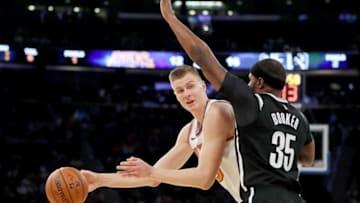 NEW YORK, NY - OCTOBER 27: Kristaps Porzingis #6 of the New York Knicks tries to get around Trevor Booker #35 of the Brooklyn Nets at Madison Square Garden on October 27, 2017 in New York City. (Photo by Elsa/Getty Images)