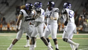 Nov 27, 2014; Austin, TX, USA; TCU Horned Frogs defensive end James McFarland (40) celebrates with teammates after a sack against the Texas Longhorns during the game at Darrell K Royal-Texas Memorial Stadium. Mandatory Credit: Brendan Maloney-USA TODAY Sports