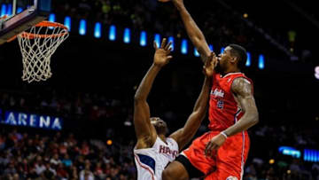 Dec 4, 2013; Atlanta, GA, USA; Los Angeles Clippers center DeAndre Jordan (6) attempts to dunk over Atlanta Hawks power forward Paul Millsap (4) in the first quarter at Philips Arena. Mandatory Credit: Daniel Shirey-USA TODAY Sports