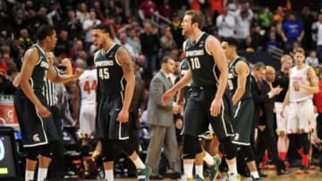 Mar 14, 2015; Chicago, IL, USA; Michigan State Spartans guard Denzel Valentine (45) and forward Matt Costello (10) react as they head back to the bench for a timeout against the Maryland Terrapins during the second half in the semifinals of the Big Ten Tournament at United Center. Mandatory Credit: David Banks-USA TODAY Sports