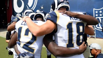 LOS ANGELES, CA - AUGUST 25: Brandin Cooks #12 and Cooper Kupp #18 of the Los Angeles Rams huddle before taking the field in a preseason game at Los Angeles Memorial Coliseum on August 25, 2018 in Los Angeles, California. (Photo by Harry How/Getty Images)