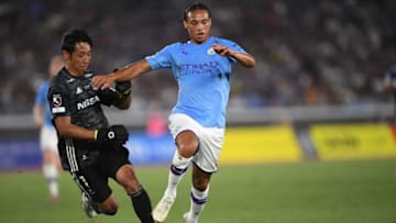 Manchester City's midfielder Leroy Sane (R) runs with the ball past Yokohama F. Marinos' goalkeeper Park Iru-gyu during a friendly football match between English Premier League club Manchester City and Japan League Yokohama F. Marinos at the Yokohama Stadium, in Yokohama on July 27, 2019. (Photo by CHARLY TRIBALLEAU / AFP) (Photo credit should read CHARLY TRIBALLEAU/AFP/Getty Images)